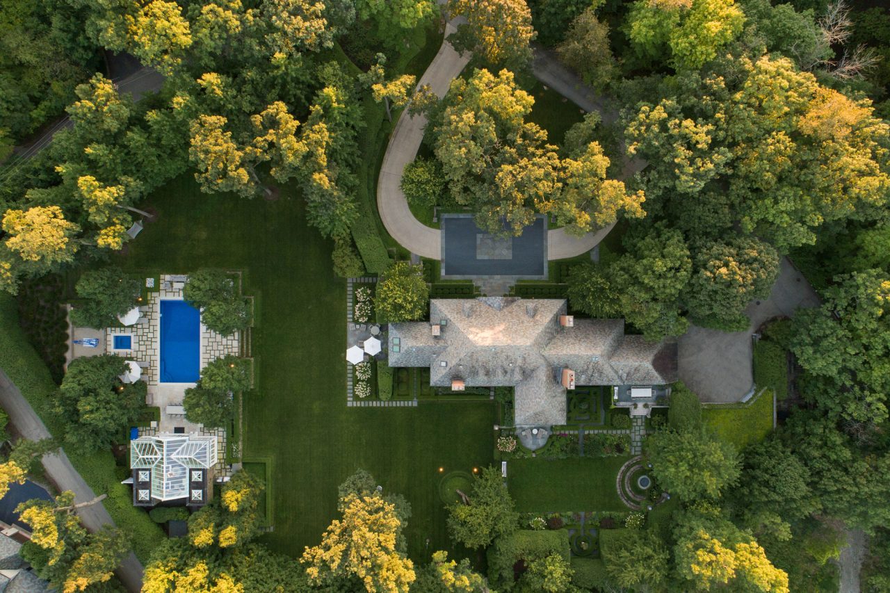 An award winning formal, residential landscape design with a pool and destination gardens.