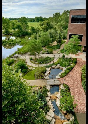 An award winning commercial landscape design featuring a natural creek, boulder outcropping and multiple garden destinations.