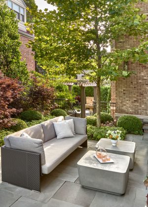 Comfortable seating area with Japanese Maples, Boxwoods, and Sycamore Tree.